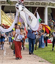 Marchers make their way through Byrd Park during Richmond’s PeaceFest 2025 on Sunday, Sept. 21, a celebration of “A Day for Peace and the Planet” that combines International Sun Day and the United Nations’ International Peace Day.
