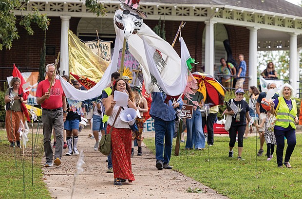 Marchers make their way through Byrd Park during Richmond’s PeaceFest 2025 on Sunday, Sept. 21, a celebration of “A Day for Peace and the Planet” that combines International Sun Day and the United Nations’ International Peace Day.