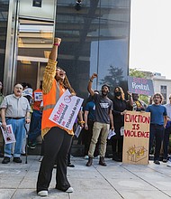 Amoree Speed, of New Virginia Majority, leads a round of chants during a news conference Monday, Sept. 22 outside City Hall.