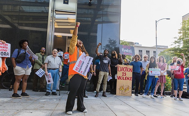 Amoree Speed, of New Virginia Majority, leads a round of chants during a news conference Monday, Sept. 22 outside City Hall.