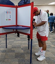 Leo Smith casts a ballot on the first day of early inperson
voting Friday, Sept. 19, at the voting location on Nine Mile Road in eastern Henrico County. The Richmond Office of Elections later reported that more than 280 incorrect ballots had been provided to voters in multiple districts.