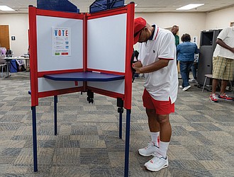 Leo Smith casts a ballot on the first day of early inperson
voting Friday, Sept. 19, at the voting location on Nine Mile Road in eastern Henrico County. The Richmond Office of Elections later reported that more than 280 incorrect ballots had been provided to voters in multiple districts.