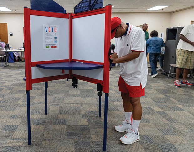 Leo Smith casts a ballot on the first day of early inperson
voting Friday, Sept. 19, at the voting location on Nine Mile Road in eastern Henrico County. The Richmond Office of Elections later reported that more than 280 incorrect ballots had been provided to voters in multiple districts.