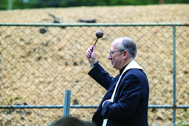 Bishop Barry Knestout of the Catholic Diocese of Richmond blesses the land of an affordable housing community in Richmond’s North Side during Commonwealth Catholic Charities’ groundbreaking ceremony on Sunday,
Sept. 21.