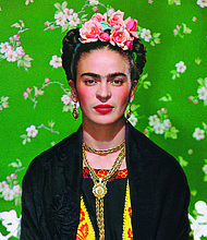 The artist Frida Kahlo, as seen in “Frida on White Bench,
New York, 1939,” by Nickolas Muray.