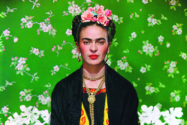 The artist Frida Kahlo, as seen in “Frida on White Bench,
New York, 1939,” by Nickolas Muray.