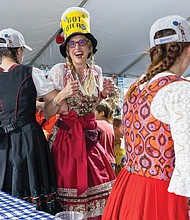 Music, food and beer flow at Oktoberfest- It wasn’t quite October, but Richmonders came out to the Museum District on Friday, Sept. 19, for the 20th annual St. Benedict’s Oktoberfest. The three-day festival features live music and dancing, a Christkindlmarkt, children’s activities, German food and beers from Germany and local breweries. A musician performs at the festival, which raises funds to support Catholic education, including scholarships and financial aid for students at Saint Benedict Catholic School and other diocesan schools. (Julianne Tripp Hillian/Richmond Free Press)