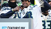 Russell Wilson holds the Lombardi Trophy at CenturyLink Field. Wilson won the 2014 Super Bowl with Seattle and has embarked upon his 14th NFL season. He became the first Black quarterback in New York Giants history
to start a season opener and was recently named the National Black Players Coalition’s “Quarterback of the Century” for his on- and off-field achievements.