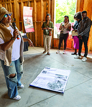 Cityscape Slices of life and scenes in Richmond-JXN Project Executive Director Sesha Joi Moon welcomed guests to the nonprofit’s
dedication day Saturday, Sept. 21, at the JXN Haus and Skipwith-Roper Cottage. During the event, community members wrote well wishes on the building’s framing and contributed notes for a time capsule to be buried on the property. The JXN Project aims to contextualize
the origins of the Jackson Ward neighborhood. Once a thriving center of Black economic and political life, Jackson Ward was transformed by the construction of the Richmond-Petersburg Turnpike in
the 1950s, which displaced more than 1,000 families, including the last Black homeowners of the Skipwith-Roper Cottage. Research revealed that the cottage was relocated rather than destroyed, and remnants of the original structure still exist. The restored Skipwith-Roper Cottage and JXN Haus will serve as a multifunctional space for research and community programming.(Julianne Tripp/Hillian/Richmond Free Press)