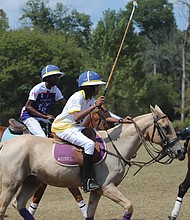 The Atlanta BEST Academy Polo Team competes against the Starr Creek Polo Club during the eighth annual Atlanta Polo Party last week.