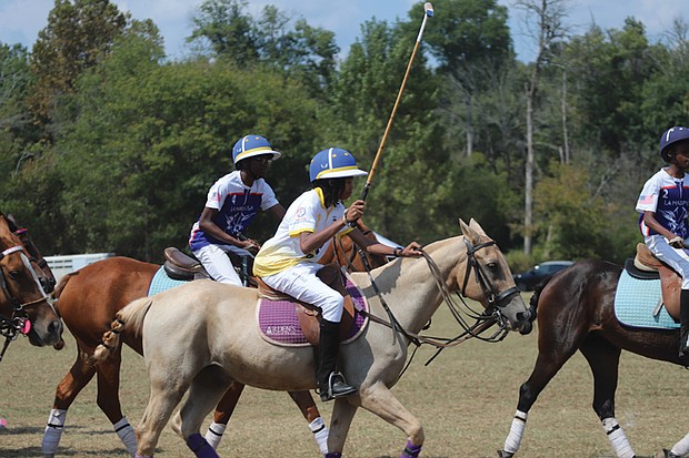 The Atlanta BEST Academy Polo Team competes against the Starr Creek Polo Club during the eighth annual Atlanta Polo Party last week.