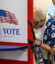 Carol Coleman Nesbit casts her ballot on the first day of early
in-person voting at the Eastern Henrico polling location on Nine Mile Road.