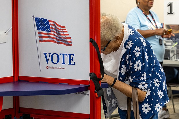 Carol Coleman Nesbit casts her ballot on the first day of early
in-person voting at the Eastern Henrico polling location on Nine Mile Road.