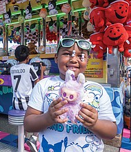 State of fun-The State Fair of Virginia returned to The Meadow Event Park in Doswell last weekend,drawing crowds from across the Commonwealth and beyond. Fairgoers packed the midway, sampling food from vendors, testing their luck at carnival games and taking in the rides. The fair, which opened Sept. 26, continues through Oct. 5. A delighted Sariyah Davis wins A Labubu doll, one of the popular collectible toys created by Hong Kong artist Kasing Lung that have become a global phenomenon. (Sandra Sellars/Richmond Free Press)