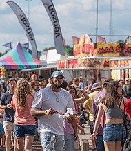 State of fun-The State Fair of Virginia returned to The Meadow Event Park in Doswell last weekend,drawing crowds from across the Commonwealth and beyond. Fairgoers packed the midway, sampling food from vendors, testing their luck at carnival games and taking in the rides. The fair, which opened Sept. 26, continues through Oct. 5. Crowds pack the midway at the State Fair, browsing food and game vendors lining the bustling walkway. (Sandra Sellars/Richmond Free Press)