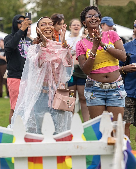 Pride in full color
Virginia PrideFest 2025 drew crowds to Midtown Green on West Leigh Street
on Saturday, Sept. 27, concluding a week of events organized by VA Pride. The festival featured all-day performances on two stages, along with vendors offering food and drinks. Kaila Robinson and Angelica Jackson enjoy a performance at the event by local cover band What’s Our Age Again? The festival featured all-day performances on two stages. (Julianne Tripp Hillian/Richmond Free Press)