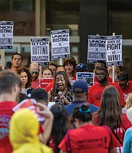Dozens of educators, local lawmakers and community members rally to urge the Richmond School Board to reject a collective bargaining proposal.
