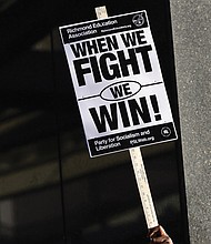 Dozens of educators, local lawmakers and community members rally to urge the Richmond School Board to reject a collective bargaining proposal. (Julianne Tripp Hillian/Richmond Free Press)