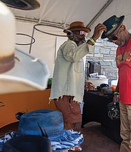 Fun first at Second-Street Festival-The 2nd Street Festival marked its 37th anniversary Oct. 4-5, filling Richmond’s historic Jackson Ward with music, food and community spirit. The annual event celebrates the culture and legacy of Jackson Ward — once known as “the Harlem of the South” — and the neighborhood’s role as the heart of Richmond’s Black community. The free festival featured three stages of live entertainment, a Kidz Zone, food vendors, an Artists Row, and a marketplace showcasing local talent and craftsmanship. Jerry Stevenson shops for a hat with Michael Kassel Wyatt at the Jackson Ward event on Saturday. (Julianne Tripp Hillian/Richmond Free Press)