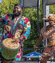 Fun first at Second Street Festival-Dancer Mayah Walker Taylor, right, and drummer Zion Utsey, left, of Ezibu Muntu perform on the Eggleston Hotel Community Stage on Saturday, Oct. 4, during the annual 2nd Street Festival in Jackson Ward. (Julianne Tripp Hillian/Richmond Free Press)