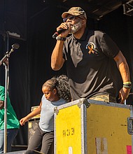 Fun first at Second-Street Festival-The 2nd Street Festival marked its 37th anniversary Oct. 4-5, filling Richmond’s historic Jackson Ward with music, food and community spirit. The annual event celebrates the culture and legacy of Jackson Ward — once known as “the Harlem of the South” — and the neighborhood’s role as the heart of Richmond’s Black community. The free festival featured three stages of live entertainment, a Kidz Zone, food vendors, an Artists Row, and a marketplace showcasing local talent and craftsmanship. A street party’s not a party without line dancing and
Kemel Patton, known as the “the Line Dance King of RVA” moves the crowd. (Julianne Tripp Hillian/Richmond Free Press)