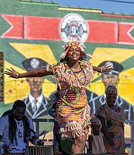 Second to Fun-Mayah Walker-Taylor of Ezibu Muntu performs on the
Eggleston Hotel Community Stage during the annual 2nd Street Festival in Jackson Ward. (Julianne Tripp Hillian/Richmond Free Press)