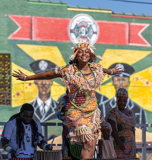 Second to Fun-Mayah Walker-Taylor of Ezibu Muntu performs on the
Eggleston Hotel Community Stage during the annual 2nd Street Festival in Jackson Ward. (Julianne Tripp Hillian/Richmond Free Press)