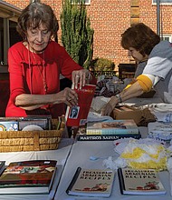 A Taste of Armenia-Richmond’s oldest and longest-running food festival returned Friday, Oct. 3, as St. James Armenian Church on the
corner of Patterson and Pepper hosted its annual Armenian Food Festival. The two-day event brought the community together for authentic Armenian cuisine, from savory kebabs to sweet pastries. The festival showcased
not just food, but the warmth of a community keeping its rich cultural traditions alive. On Friday, Oct 3 Stella Bandazian and Seta
Kupelian set out items sourced directly from Armenia to sell at the gift shop of the long-running food festival. (Julianne Tripp Hillian/Richmond Free Press)