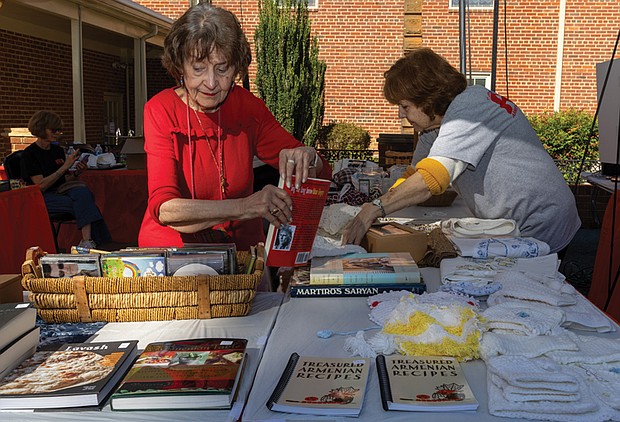 A Taste of Armenia-Richmond’s oldest and longest-running food festival returned Friday, Oct. 3, as St. James Armenian Church on the
corner of Patterson and Pepper hosted its annual Armenian Food Festival. The two-day event brought the community together for authentic Armenian cuisine, from savory kebabs to sweet pastries. The festival showcased
not just food, but the warmth of a community keeping its rich cultural traditions alive. On Friday, Oct 3 Stella Bandazian and Seta
Kupelian set out items sourced directly from Armenia to sell at the gift shop of the long-running food festival. (Julianne Tripp Hillian/Richmond Free Press)