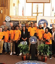 Recent graduates gather Friday for a group photo during the ceremony marking the completion of the city’s first community-based workforce development program, a partnership between the City of Richmond, LIUNA and Kirila Construction Services.