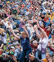 Celebrating sound, spirit and tradition-Thousands of people filled
Brown’s Island and the riverfront for this year’s Richmond Folk Festival, a three-day celebration of music, culture and community. From traditional Appalachian tunes to global rhythms, the event once again brought together artists and audiences from across the world. The annual event is one of the region’s most anticipated weekends. Attendees enjoy a performance at the festival on Brown’s Island. (Sandra Sellars/Richmond Free Press)