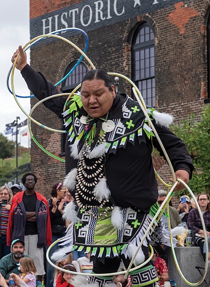 Celebrating sound, spirit and tradition-Thousands of people filled
Brown’s Island and the riverfront for this year’s Richmond Folk Festival, a three-day celebration of music, culture and community. From traditional Appalachian tunes to global rhythms, the event once again brought together artists and audiences from across the world. The annual event is one of the region’s most anticipated weekends. Sampson Sinquah performs a Hopi hoop dance with the Sinquah Family Dancers during the 21st annual Richmond Folk Festival. (Sandra Sellars/Richmond Free Press)