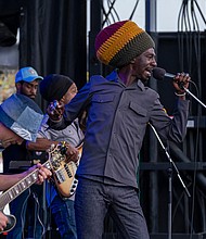 Rhythms on the riverfront-Meta & the Cornerstones performs at the Richmond Folk Festival on Brown’s Island. The festival kicked off its 21st year Friday with music, food and large crowds. The music continued Saturday and Sunday, starting at noon each day. (Sandra Sellars/Richmond Free Press)