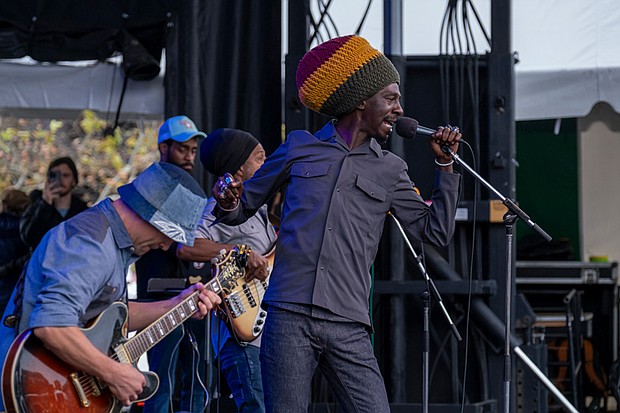 Rhythms on the riverfront-Meta & the Cornerstones performs at the Richmond Folk Festival on Brown’s Island. The festival kicked off its 21st year Friday with music, food and large crowds. The music continued Saturday and Sunday, starting at noon each day. (Sandra Sellars/Richmond Free Press)