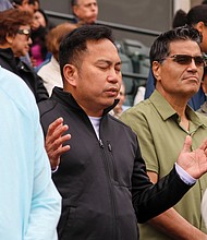 Worshippers reflect during the praise and worship service at Catholic Fest, held Oct. 11 at The Diamond.