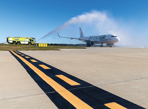 Cityscape-Slices of life and scenes in Richmond-A Frontier Airlines flight from Hartsfield-Jackson Atlanta International Airport passes through a ceremonial water arch after landing at Richmond International Airport on Oct. 21. The arrival marked Frontier’s first passenger flight to Richmond and the start of new nonstop service between the two cities. Airport officials said the addition of Frontier expands travel options for Central Virginia passengers and strengthens connections to major hubs in the South and West. The airline has also added new nonstop service from Richmond to Denver. (Julianne Tripp Hillian/Richmond Free Press)