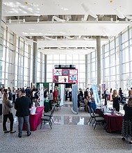 Students interact with business representatives during the HMGT Career Fair on Thursday, Mar 20, 2025 in College Station, Texas. (Hannah Harrison/Texas A&M AgriLife)