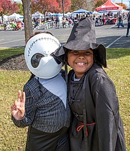 Fall Festivities in full swing at Midtown Green-Friends Harmony Moore and Kayden Smalls, both 9, show off their Halloween flair as the Skeleton from “The Nightmare Before Christmas” and a K-Pop demon hunter at Midtown Green’s Pumpkin Festival costume contest. Hundreds of area residents embraced the fall spirit at the Scott’s Addition Pumpkin Festival on Saturday, Oct. 25. Held from noon to 6 p.m. at Midtown Green, the free, family-friendly event featured live music, more than 70 food trucks, a kids zone and a costume contest for kids, pets and adults. Attendees enjoyed local cuisine, beverages and entertainment throughout the afternoon. The event was organized by Three One One Productions and benefited NextUp RVA, a nonprofit that supports youth development through after-school programs. (Sandra Sellars/Richmond Free Press)