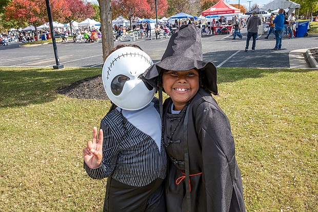 Fall Festivities in full swing at Midtown Green-Friends Harmony Moore and Kayden Smalls, both 9, show off their Halloween flair as the Skeleton from “The Nightmare Before Christmas” and a K-Pop demon hunter at Midtown Green’s Pumpkin Festival costume contest. Hundreds of area residents embraced the fall spirit at the Scott’s Addition Pumpkin Festival on Saturday, Oct. 25. Held from noon to 6 p.m. at Midtown Green, the free, family-friendly event featured live music, more than 70 food trucks, a kids zone and a costume contest for kids, pets and adults. Attendees enjoyed local cuisine, beverages and entertainment throughout the afternoon. The event was organized by Three One One Productions and benefited NextUp RVA, a nonprofit that supports youth development through after-school programs. (Sandra Sellars/Richmond Free Press)