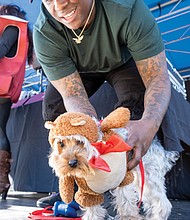 Fall Festivities in full swing at Midtown Green-Teddy Bear the Yorkie and his human, Gloria Washington, participate in the costume contest at the Pumpkin Festival. Hundreds of area residents embraced the fall spirit at the Scott’s Addition Pumpkin Festival on Saturday, Oct. 25. Held from noon to 6 p.m. at Midtown Green, the free, family-friendly event featured live music, more than 70 food trucks, a kids zone and a costume contest for kids, pets and adults. Attendees enjoyed local cuisine, beverages and entertainment throughout the afternoon. The event was organized by Three One One Productions and benefited NextUp RVA, a nonprofit that supports youth development through after-school programs. (Sandra Sellars/Richmond Free Press)