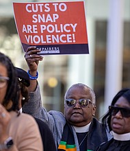 Dozens of Virginians, including clergy and community leaders are seen outside the offices of U.S. Sens. Tim Kaine and Mark Warner at 919 E. Main St. in Richmond as part of a coordinated, nonviolent mass prayer action held at congressional offices across the
country.