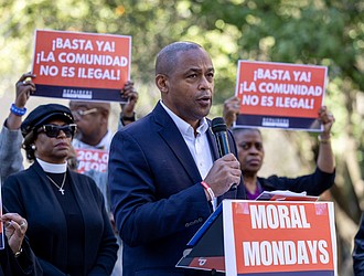 The Rev. Billy Cook, an Army veteran, speaks about how recent policies have affected him and other veterans during a “pray-in” outside the offices of U.S. Sens. Tim Kaine and Mark Warner at 919 E. Main St. in Richmond.