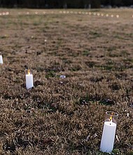 Battery-powered candles marked the future site of a 12-foot bronze sculpture commemorating the arrival point of enslaved people on the banks of the James River during the Shockoe Project Celebration at Ancarrow’s Landing in 2024.