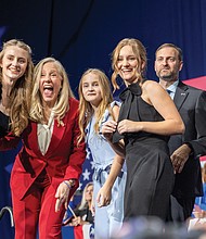Abigail Spanberger celebrates with her family at the Greater Richmond Convention Center on Tuesday after being elected Virginia’s 75th governor, defeating Republican Winsome Earle-Sears.