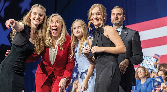 Abigail Spanberger celebrates with her family at the Greater Richmond Convention Center on Tuesday after being elected Virginia’s 75th governor, defeating Republican Winsome Earle-Sears.