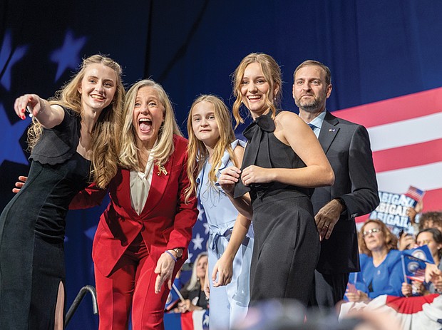 Abigail Spanberger celebrates with her family at the Greater Richmond Convention Center on Tuesday after being elected Virginia’s 75th governor, defeating Republican Winsome Earle-Sears.