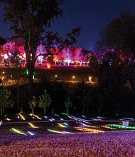 Lights and color transform Maymont for Garden Glow-Garden Glow has returned to Maymont’s gardens nightly, through Nov. 9. A child takes in the colorful light displays in Maymont’s gardens. The annual event features mesmerizing light installations by international artists — some paired with coordinated soundscapes and music — along with the activity filled Glow Village, food and drinks. Opening times and ticket prices vary. Proceeds support the care of Maymont’s gardens, resident animals and historic mansion. (Julianne Tripp Hillian/Richmond Free Press)