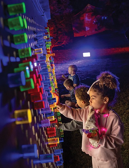 Lights and color transform Maymont for Garden Glow-Garden Glow has returned to Maymont’s gardens nightly, through Nov. 9. A child takes in the colorful light displays in Maymont’s gardens. The annual event features mesmerizing light installations by international artists — some paired with coordinated soundscapes and music — along with the activity filled Glow Village, food and drinks. Opening times and ticket prices vary. Proceeds support the care of Maymont’s gardens, resident animals and historic mansion. (Julianne Tripp Hillian/Richmond Free Press)