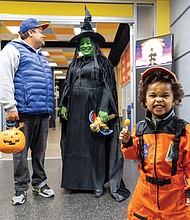 Halloween blasts off-Bryson Fischer Wesley, 4, suits up as an astronaut for Halloween on Friday during U.S. Rep. Jennifer McClellan’s annual Community Harvest Festival at the Science Museum of Virginia. The festival offered Richmond-area children a chance to trick-or-treat and explore museum exhibits and activities throughout the evening. (Julianne Tripp Hillian)