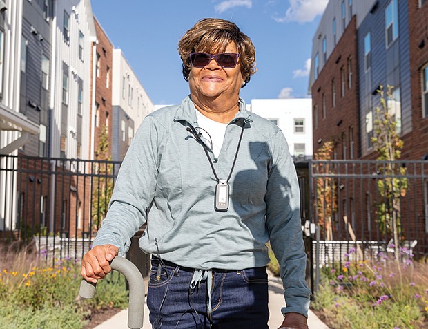 Former school site transformed into new housing-Richmond city leaders and residents gathered Oct. 30 in the city’s Oak Grove neighborhood to celebrate the opening of Noon Ingram, a 243-unit limited income housing development built on the former site of Oak Grove Elementary School. The new community offers one-, two-, and three-bedroom apartments for families earning between $35,000 and $80,000 a year, with amenities that include a swimming pool, fitness centers, outdoor recreation areas and a dog park. Marcelle Williams, a new resident of Noon Ingram, looks over her apartment in the 243-unit limited-income housing development in South Side’s Oak Grove neighborhood. Williams, who moved in Oct. 10, said she was ready for a home that required less upkeep and is pleased to see the long-abandoned site revitalized. (Julianne Tripp Hillian/Richmond Free Press)